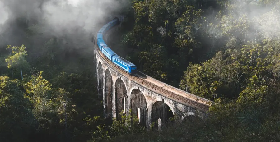 Blue train crossing the Nine Arch Bridge, Ella, Sri Lanka